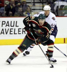 ST. PAUL, MN - NOVEMBER 23: Pascal Dupuis #11 of the Minnesota Wild looks to pass the puck against the Edmonton Oilers against on November 23, 2005 at the Xcel Energy Center in St. Paul, Minnesota. ( Photo by David Sherman/Getty Images)